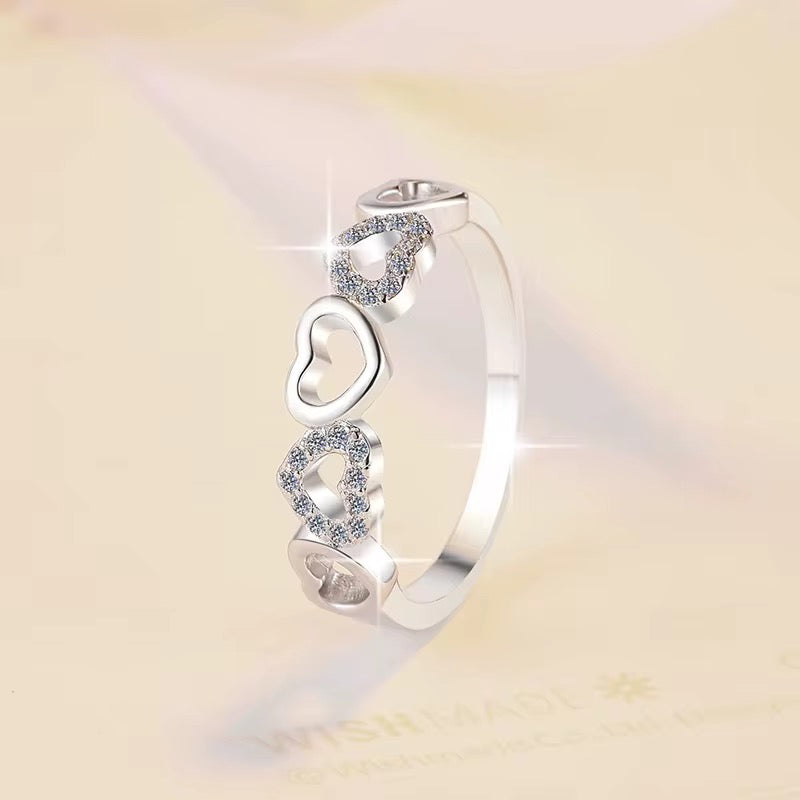 Delicate Heart-Designed Sterling Silver Ring with Moissanite Accents