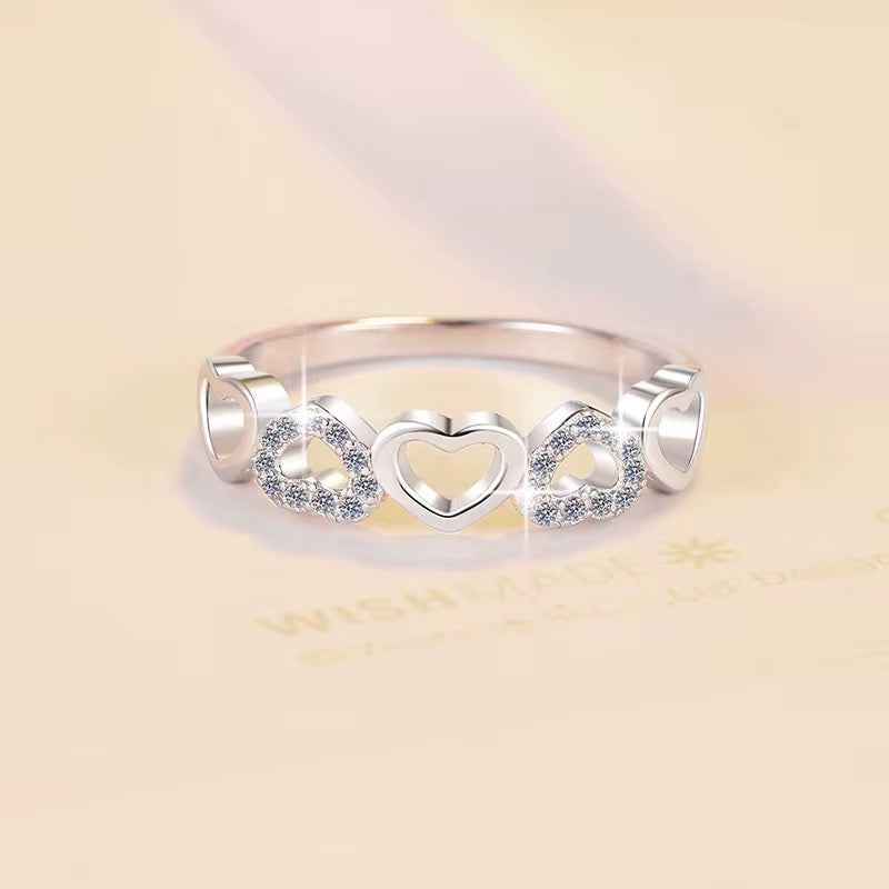 Delicate Heart-Designed Sterling Silver Ring with Moissanite Accents